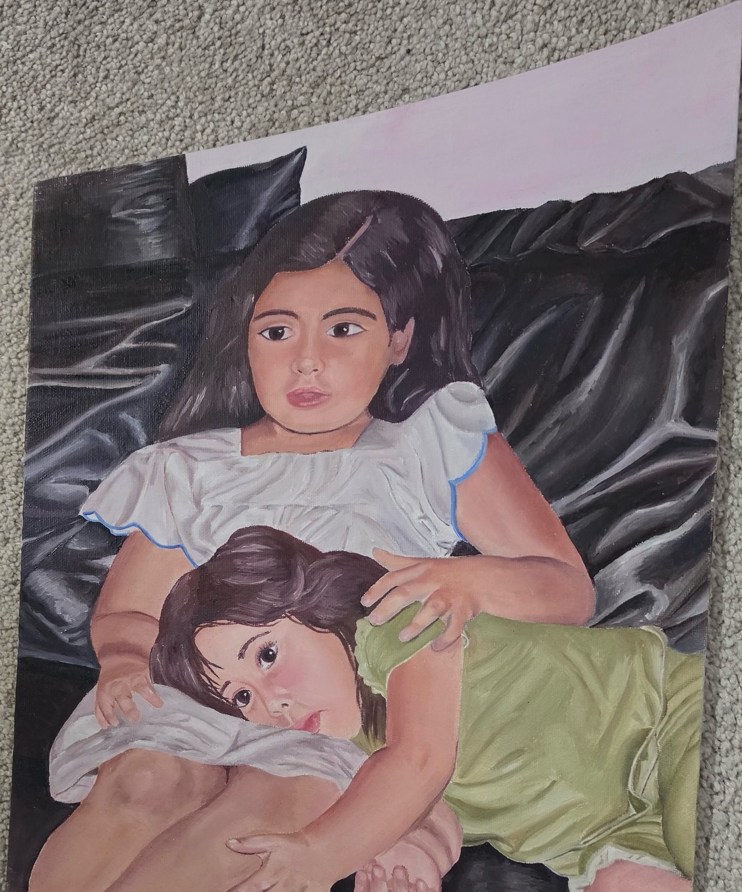 Painting of two young girls resting together on a dark leather couch, the younger lying across the older one’s lap.