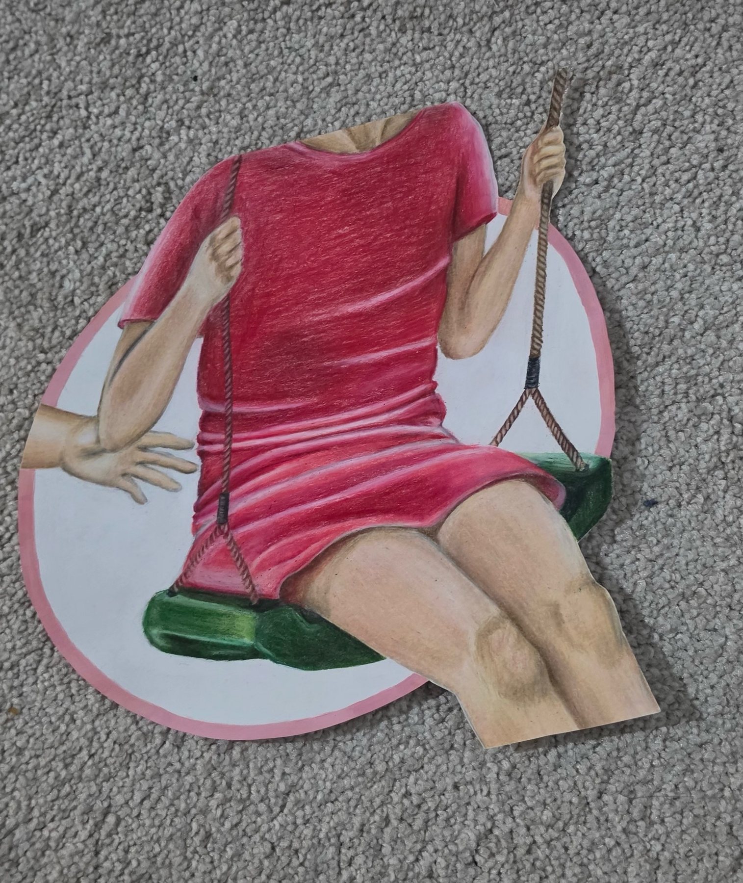 Cut-out colored pencil drawing of a figure in a red dress on a green swing, a second hand reaching in from the left.